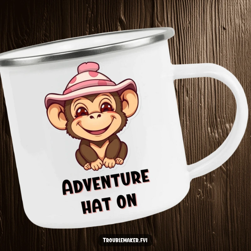 Funny camping mug with an impish monkey character wearing a silly hat, radiating fun for outdoor enthusiasts.