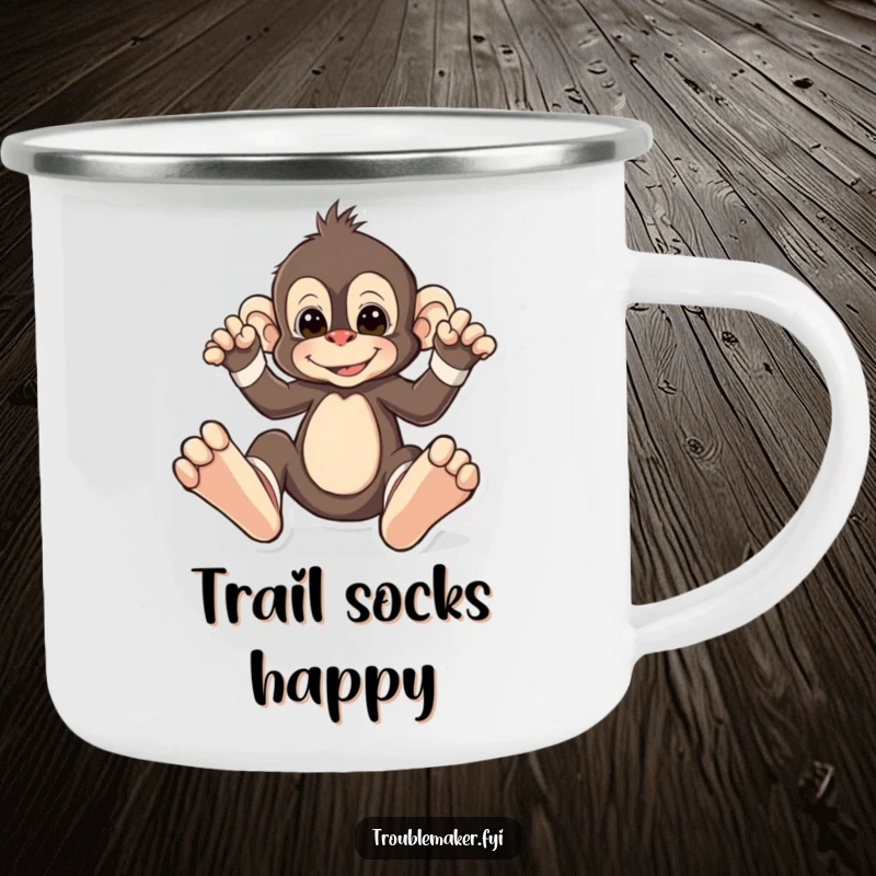 Funny camping mug showing a monkey playfully wearing oversized, mismatched socks, perfect for outdoor enjoyment and adding humorous style.