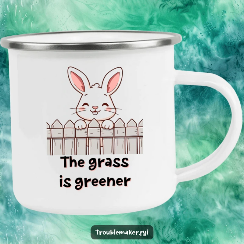 Funny camping mug with a mischievous rabbit's cheeky grin peeking over a fence, adding humor to outdoor adventures.