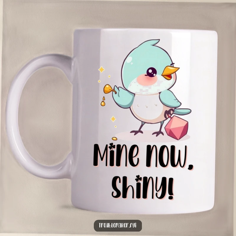 Funny Mug depicting a mischievous bird with wide eyes, playfully snatching a sparkly trinket, emphasizing its thieving nature and adorable personality.