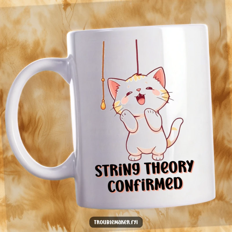 Funny mug illustration of a cute cat playfully batting at a dangling string, showcasing feline curiosity and energetic fun.
