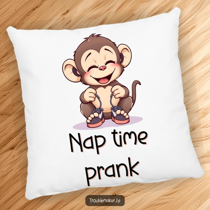 Funny pillow featuring a giggling monkey tying tiny shoelaces together, offering comfort and a humorous prank theme.