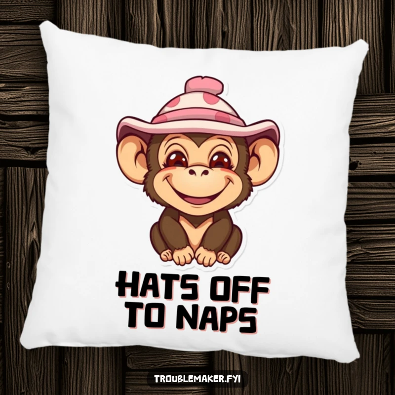 Funny pillow featuring a monkey with an impish smile and a silly hat, offering cozy comfort and comical appeal.