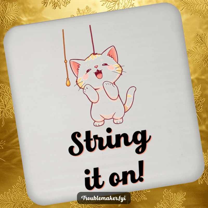 Funny drink coaster with a cat playfully batting at a dangling string, adding a touch of feline humor to tabletops.