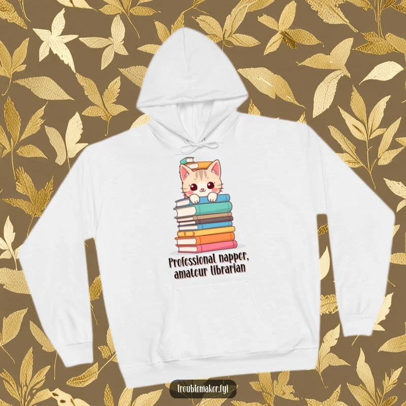 Funny cat hoodie depicting a mischievous cat peeking from behind a large pile of books, ideal for cozy reading and humorous style.
