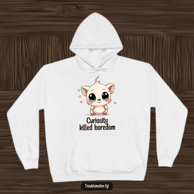 Funny hoodie featuring a small creature with wide, curious eyes causing mild chaos, perfect for staying warm while embracing playful disruption.