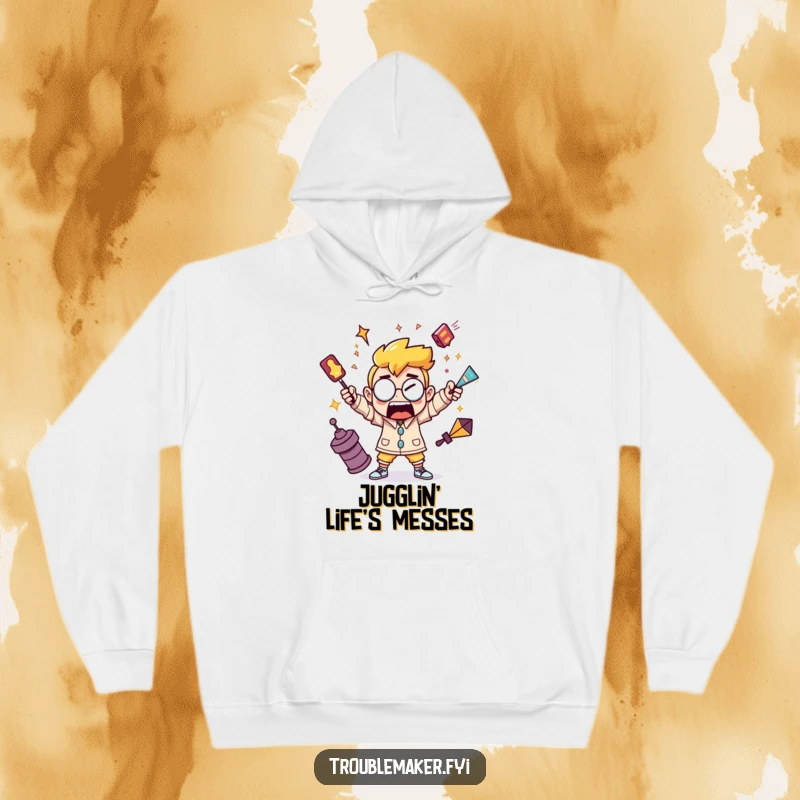 Funny hoodie with a troublemaker character juggling shiny, chaotic objects, ideal for those who embrace life's messes.