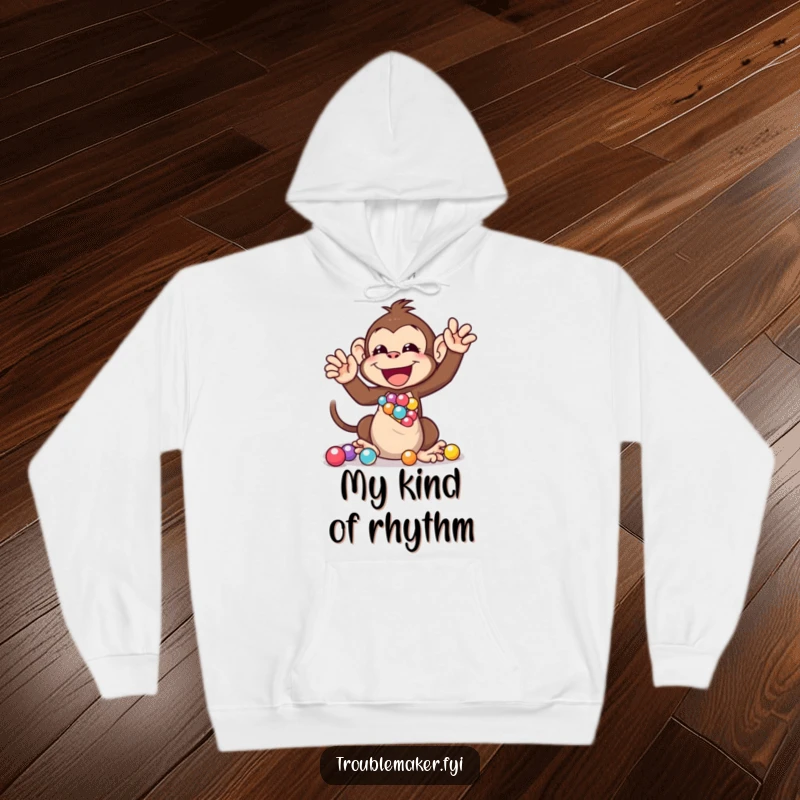 Funny hoodie depicting a monkey engrossed in the delightful act of shaking a bag full of sparkling marbles, offering cozy humor.