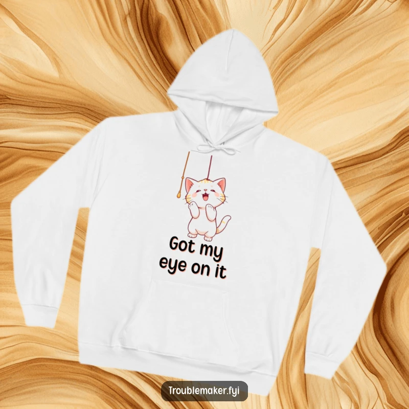 Funny hoodie featuring a cat gleefully batting at a dangling string, perfect for cozying up with a touch of playful humor.