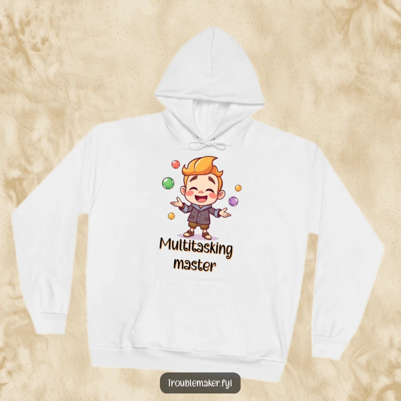 Funny troublemaker character joyfully juggling colorful marbles, depicted on a cozy hoodie, offering comfort and a splash of playful cheer.