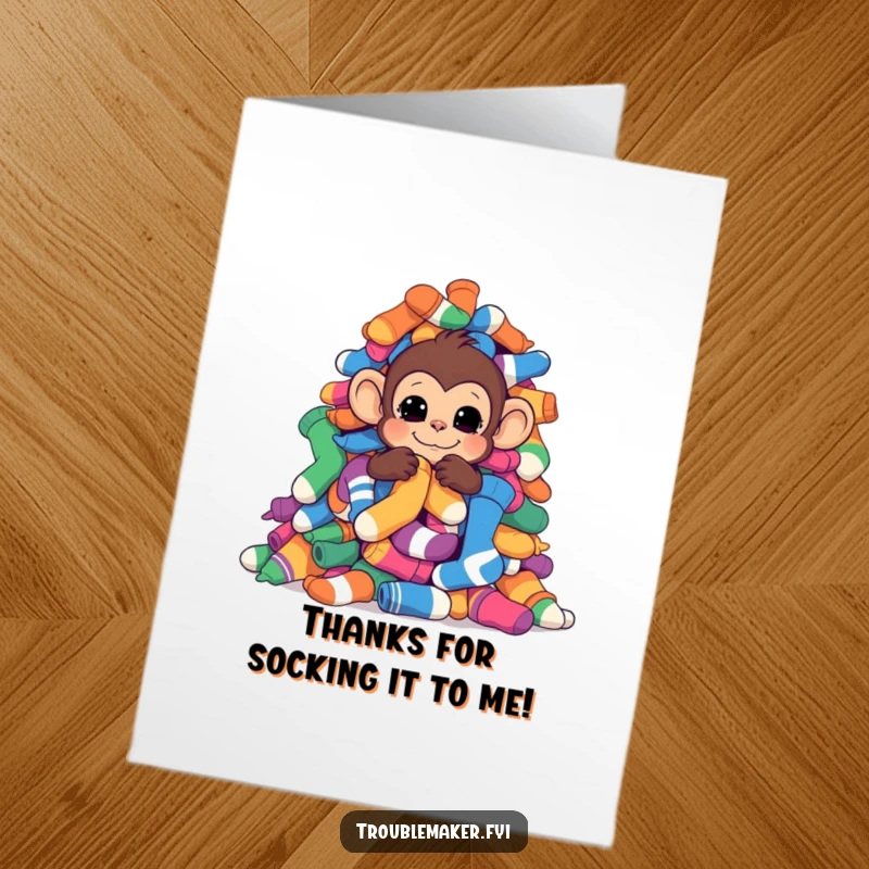 Funny Free Printable Thank You Card of a monkey peeking from behind a large pile of colorful socks.