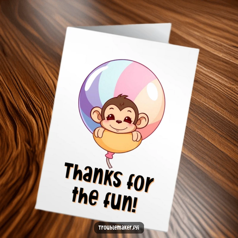 Funny Free Printable Thank You Card: Cheeky monkey peeking from behind a colorful balloon, saying thanks.