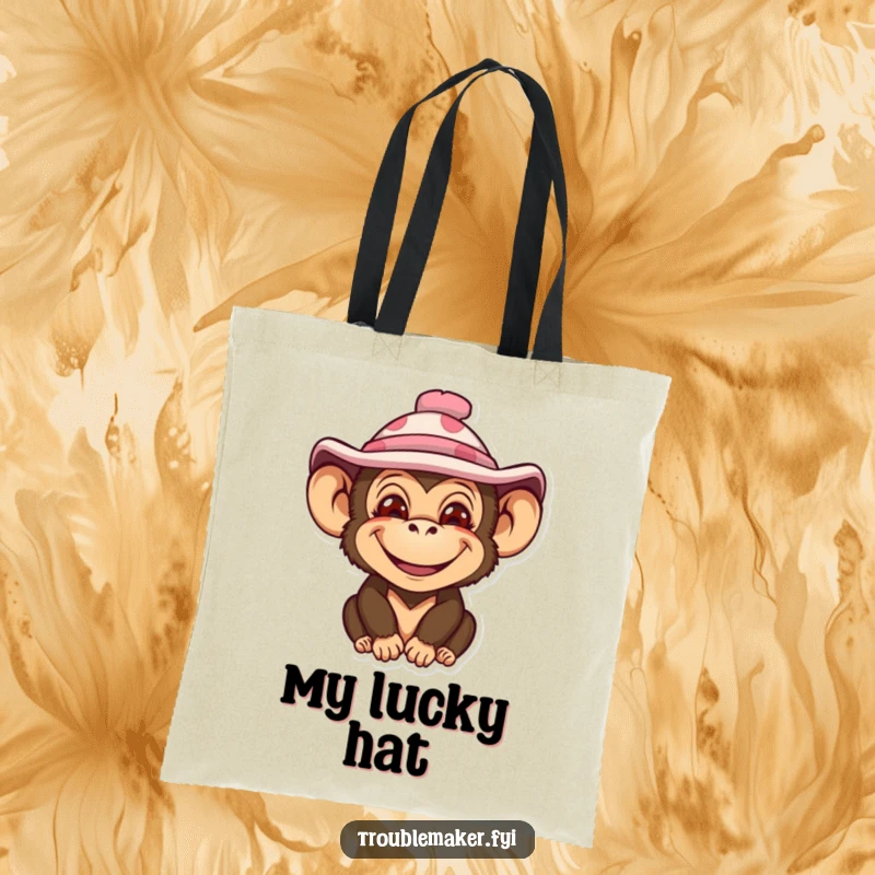 Funny tote bag featuring a monkey with an impish smile and a silly hat, designed to add humor to your day.